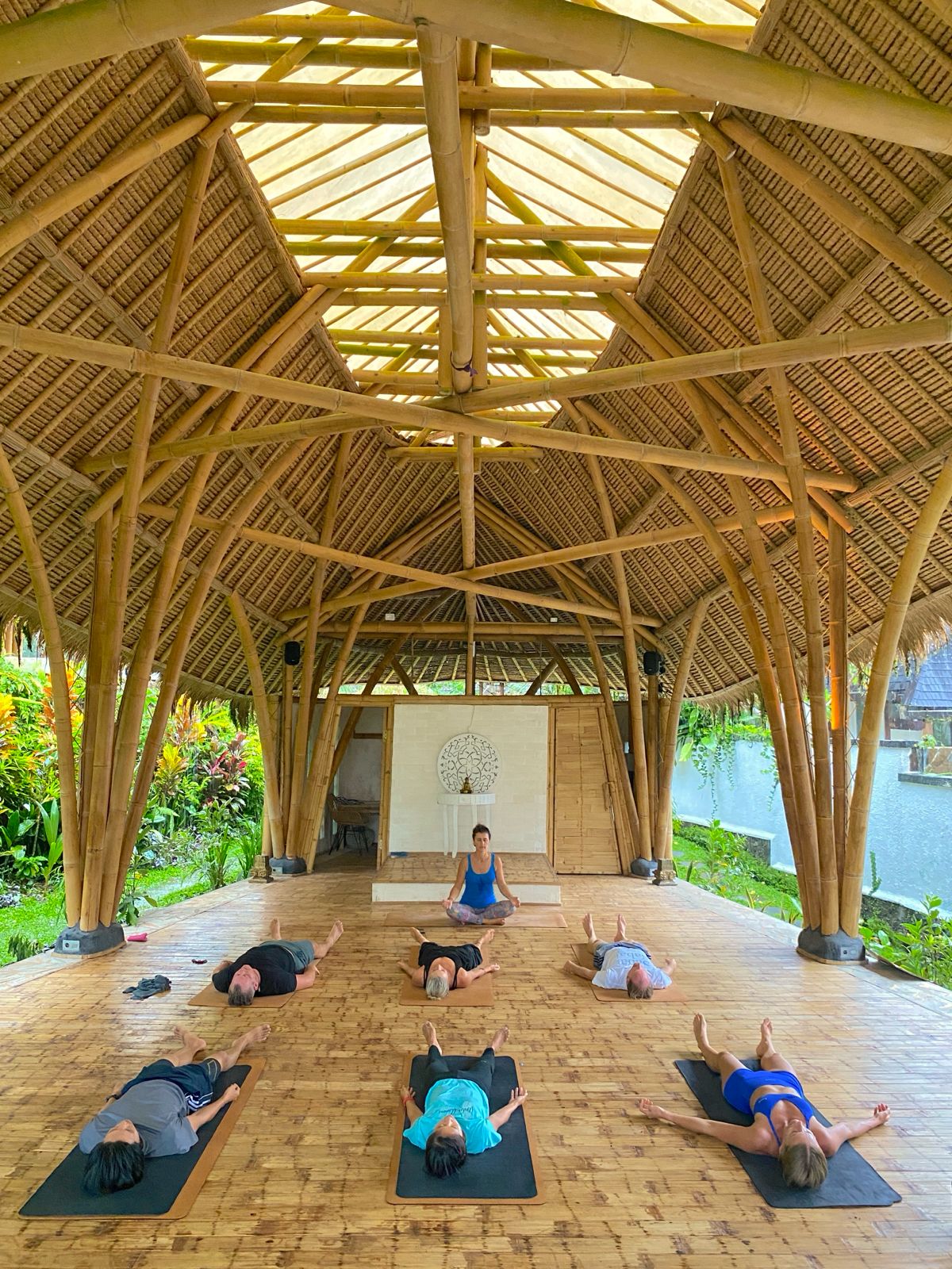 Yoga practice inside the bamboo shala