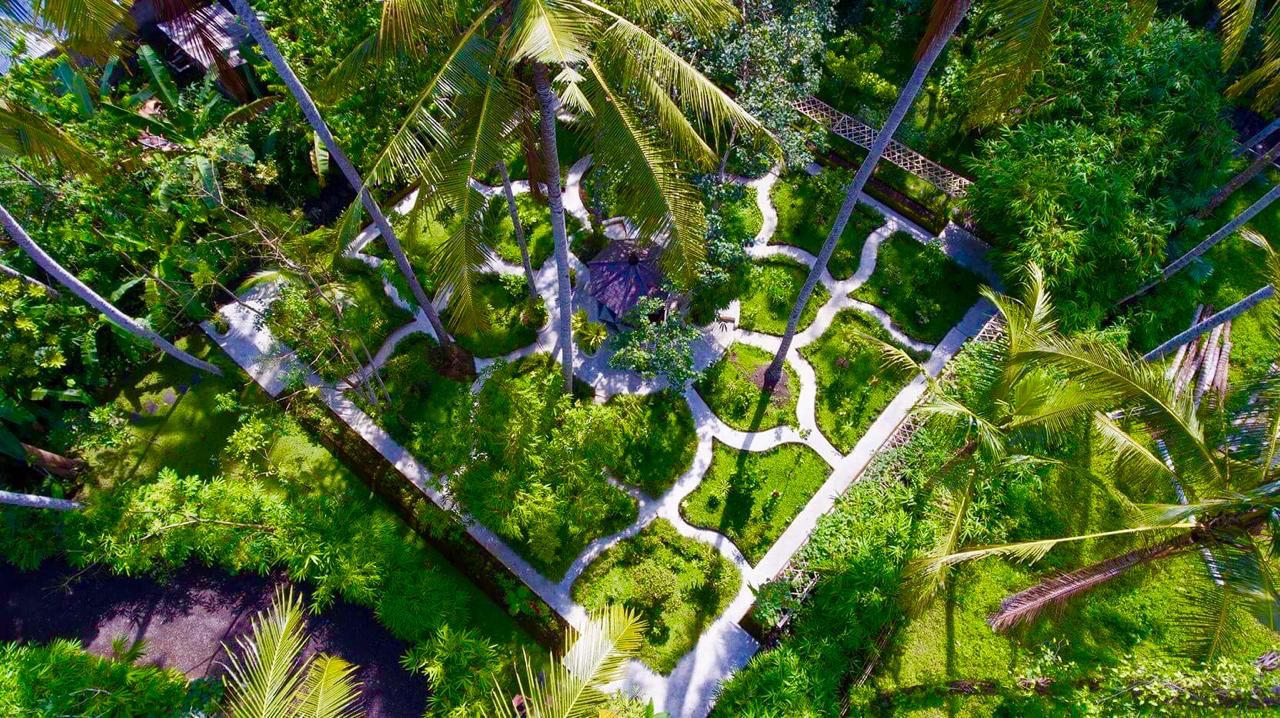 Lush tropical garden paths at Naya Eco Village